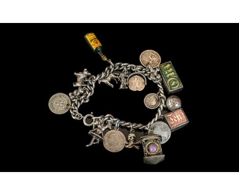 A Vintage Sterling Silver Charm Bracelet Loaded with 12 Good Silver Charms. All Marked for Silver. Comprises Old One Pound No