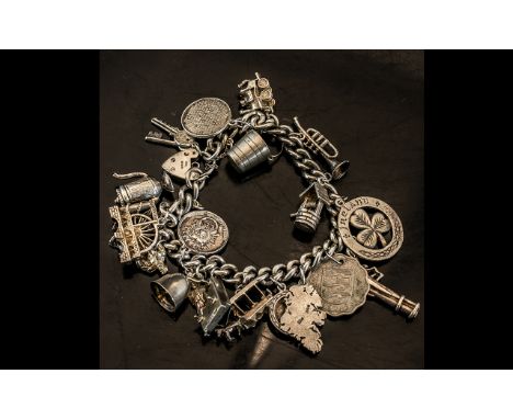 A Vintage - Sterling Silver Charm Bracelet - Loaded with 18 Silver Charms. All Marked for Silver. Comprises Napoleon Figure, 