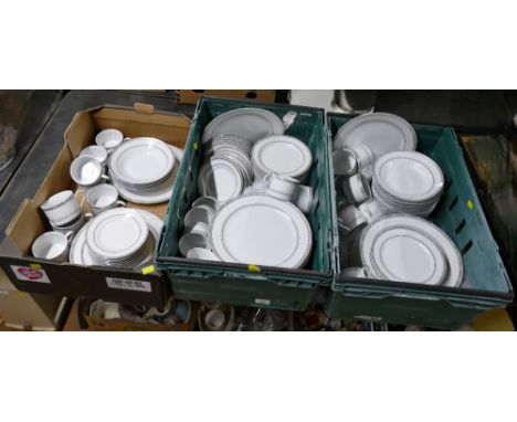 Three boxes of white and silver patterned dinner and tea service