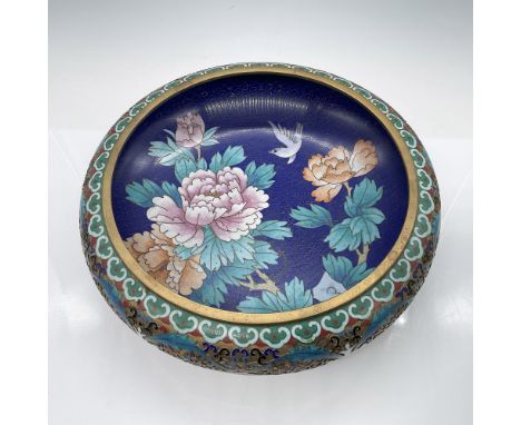 Beautiful antique cloisonne bowl featuring intricate floral designs and a bird motif against a rich blue background. The exte