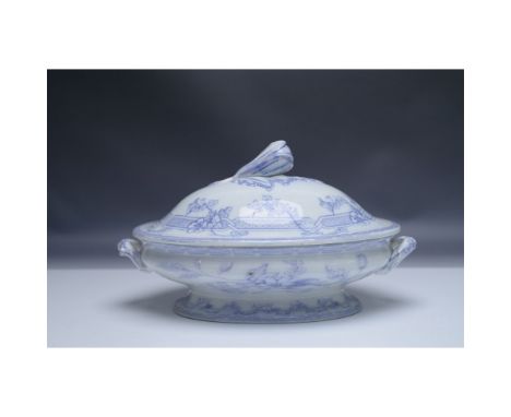 An antique blue and white transferware covered tureen featuring an elegant floral pattern. The oval-shaped tureen has ornate 