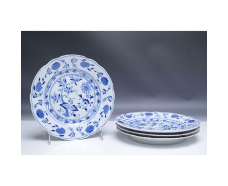 A set of porcelain plates featuring the classic Blue Onion (Zwiebelmuster) pattern, a design originating from the Meissen Por