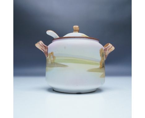 A delicate hand-painted Nippon porcelain covered sugar bowl, featuring a soft pastel landscape scene with trees and a lake. T