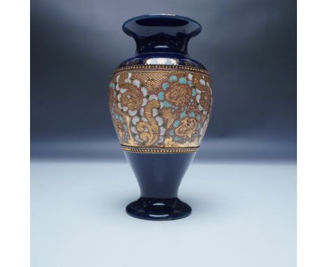 This exquisite Royal Doulton Slater's Patent vase showcases the iconic tapestry-style design, combining rich cobalt blue glaz