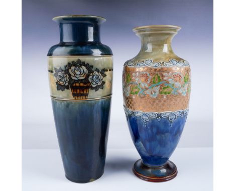 A pair of Royal Doulton vases, both hand-decorated with intricate designs. The first vase features a blue and tan gradient wi