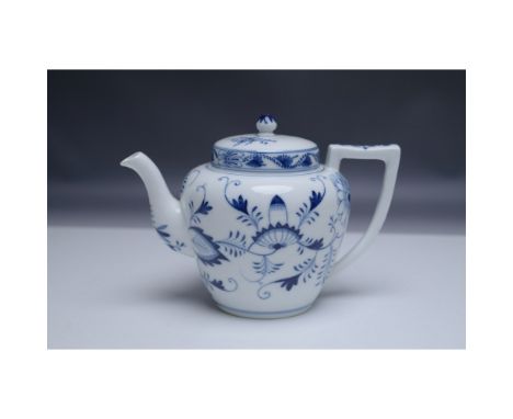This finely crafted German porcelain teapot with a matching lid in the style of the classic Blue Onion pattern. The intricate