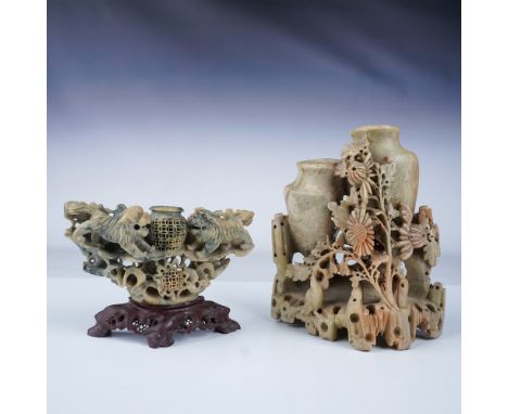 A finely crafted pair of Chinese carved soapstone vases showcasing intricate designs. The first vase features two vessel open