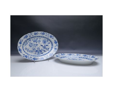 Pair of oval porcelain serving platters in the classic Blue Onion pattern, featuring intricate cobalt blue floral and vine mo