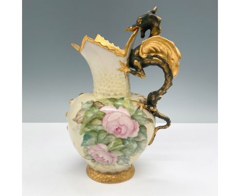 A vintage mug featuring a dragon-shaped handle adorned with gold accents. Hand-painted with vibrant blackberry and floral mot