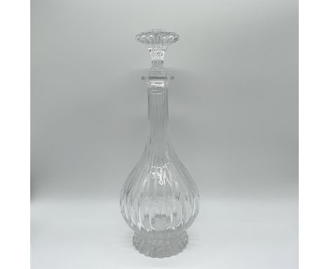 Elegant art glass decanter featuring a ribbed body and stopper. This piece showcases a flared pedestal base and elongated nec