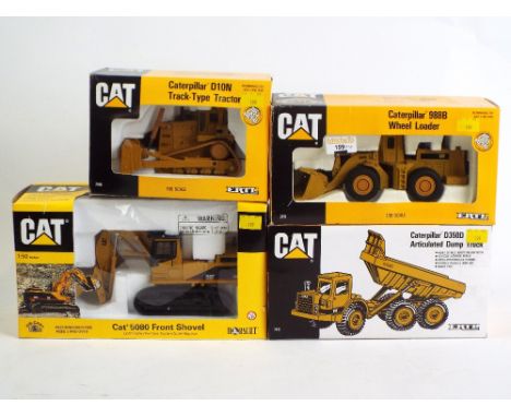 Four boxed Ertl Diecast construction vehicles, 1:50 scale, CAT front shovel 5080, CAT D350D dump truck, CAT 988B wheel loader