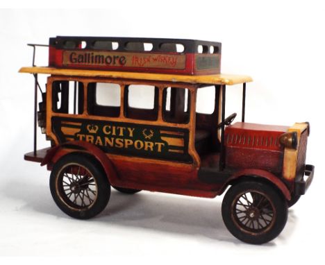 Wood and metal model of City transport omnibus with advertising banners to the sides, for Irish Whiskey and biscuits, length 