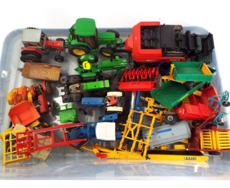Selection of Britain's farm machinery and tractors, seed drill, New Holland hay baler, roller, tipper trailer, plough, elevat