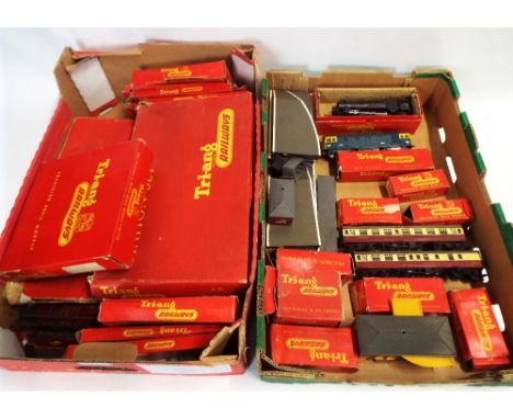 Two boxes of Triang 00 gauge model railway accessories and rolling stock, turn table, engine shed, track, buildings, platform