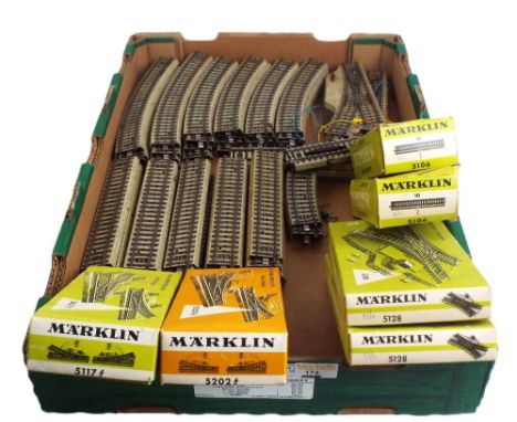 Collection of boxed and unboxed Marklin track including points and crossings