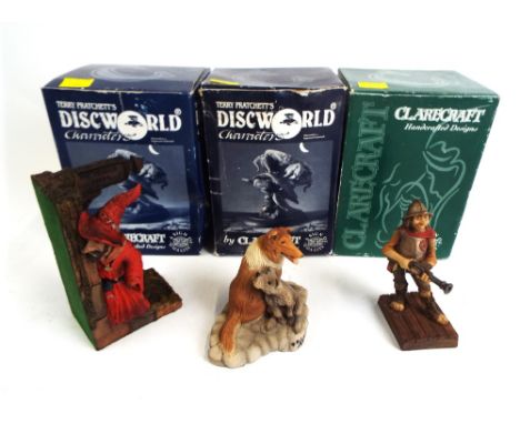 Three Clarecraft Terry Pratchett's disk world models, Rincewind bookend, DW11 and Laddie and Gaspode, DWE16 and Captain Vimes