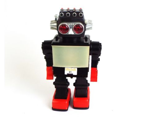 Vintage circa 1970's walking battery operated robot, walks and lights up, height 30 cm, made in Hong Kong