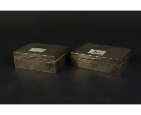 Two silver cigarette boxes, both with engine turned decoration to lid (both are as found)