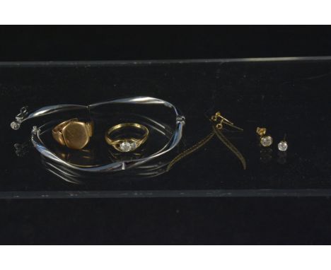 A mixed lot consisting of a 9ct white gold bangle (as found), a 9ct gold signet ring (as found), a 9ct gold white stone ring 