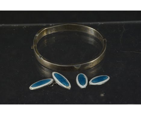 A pair of silver blue and white enamelled cufflinks (small losses) plus a Charles Horner silver bangle (dented)