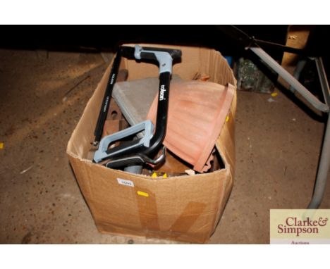 A box of various hand tools