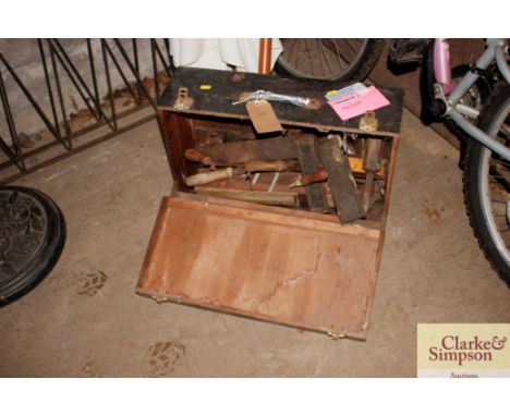 A toolbox and contents of wood working tools