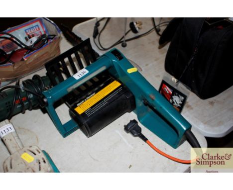 A Black and Decker electric chainsaw, lacking extension cable