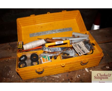 A plastic toolbox and contents