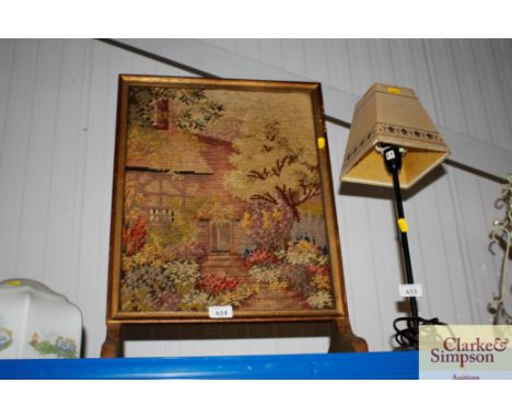 An embroidered fire screen 