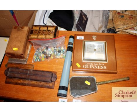 A Guinness barometer together with a hand mirror; Cribbage boards; marbles; chess pieces etc