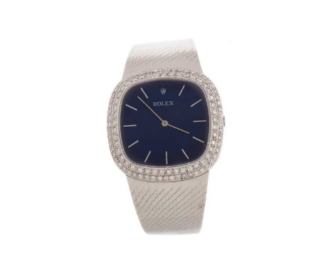 ROLEX EIGHTEEN CARAT WHITE GOLD DIAMOND SET QUARTZ WRIST WATCH,the cushion shaped blue dial with baton hour markers, double r