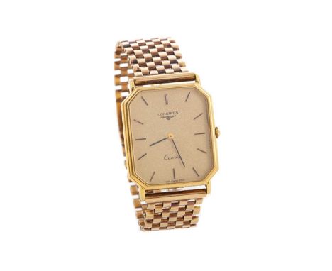 GENTLEMAN'S LONGINES NINE CARAT GOLD QUARTZ WRIST WATCH,the octagonal champagne dial with baton hour markers, 26mm case with 