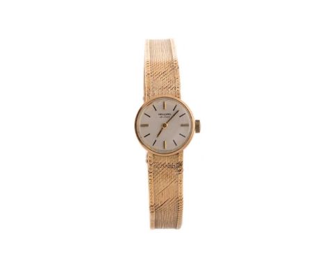 LADY'S RECORD DE LUXE NINE CARAT GOLD MANUAL WIND WRIST WATCH,the round cream dial with baton hour markers, 17mm case, on an 