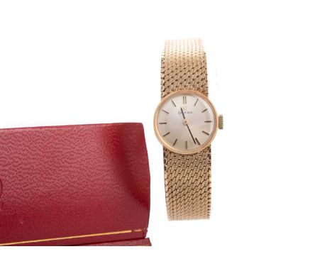 LADY'S OMEGA NINE CARAT GOLD MANUAL WIND WRIST WATCH,the round cream dial with baton hour markers, 17mm case, on a nine carat