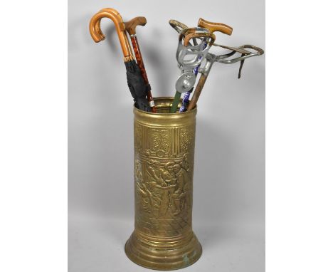 A Pressed Brass Cylindrical Stick Stand, 57cm high Containing Various Shooting Sticks, Walking Sticks and Umbrellas 