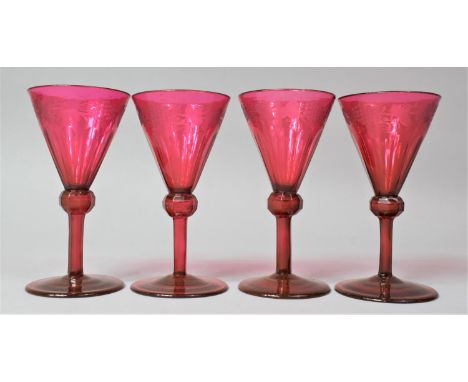 A Set of Four Hand Blown Etched Ruby Glass Wines with Trumpet Bowls and Faceted Knopped Stems, 13.5cm high 