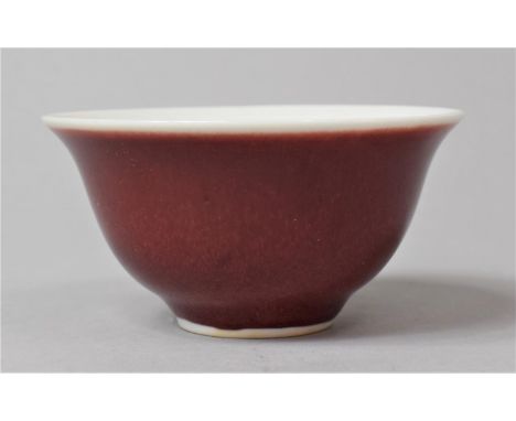 A Chinese Sang de Boeuf Glazed Porcelain Tea Bowl, Six Character Mark for Kangxi In Under Glazed Blue to Base,   9cm Diameter