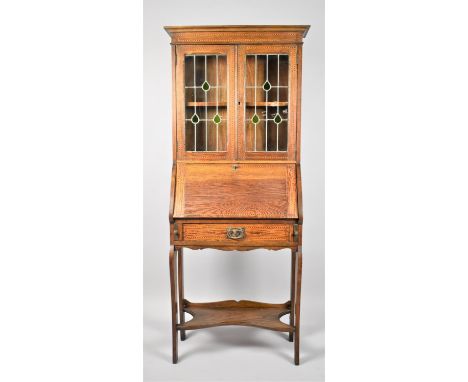 An Edwardian String Inlaid Hall Bureau Bookcase with Leaded Paneled Glazed Doors to Shelved Top, Fall Front with Fitted Inter