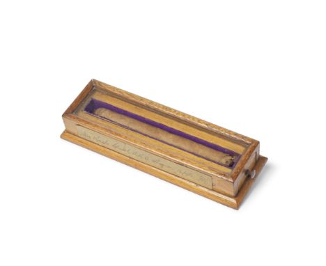 CHURCHILL (WINSTON)An unsmoked cigar, in custom-made oak presentation box with glass top and lined in purple cloth, with hand