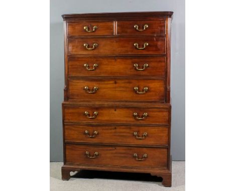 A George III mahogany tallboy, the upper part with moulded cornice, fluted cant corners, fitted two short and three long draw