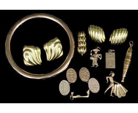 A George V 9ct gold stiff pattern bangle, Chester 1922, (gross weight 13.6 grammes), a pair of 18ct gold fan pattern earrings