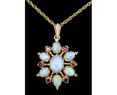A modern 9ct gold opal and garnet set pendant of flowerhead form, the face set with seven cabochon cut opals, interspersed by