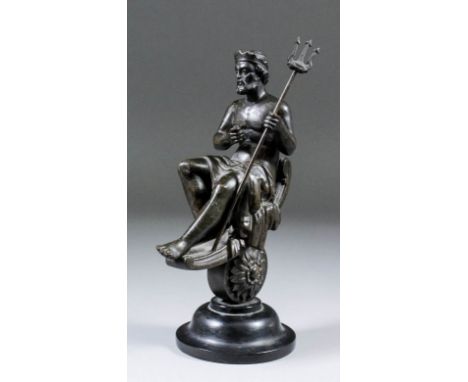 A 19th Century bronzed metal figure of Neptune, seated and holding his trident in his left hand, on turned and raised base, 9