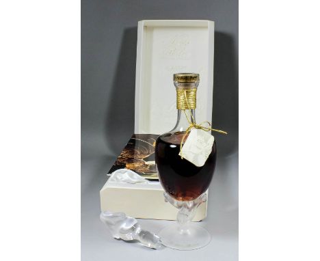 A 750ml bottle of "Noces de Perle" Special Reserve Brandy by A.Hardy, in presentation decanter with moulded and frosted base 