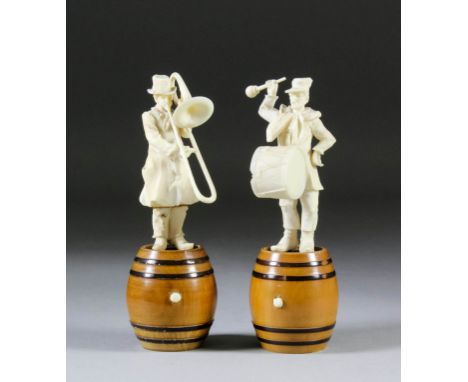 A pair of late 19th Century French carved ivory figures of standing musicians, one with drum and the other with trombone, mou