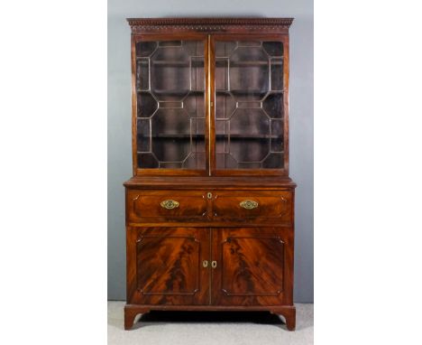 A George III mahogany secretaire bookcase, the upper part with moulded cornice with Greek key and arcaded ornament, fitted th