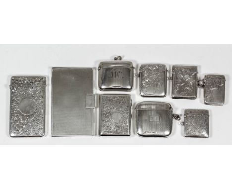 An Edward VII silver rectangular card case engraved with circular cartouche and leaf scroll ornament, 3.375ins x 1.875ins, ma