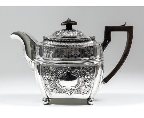 A George III silver rectangular teapot with gadroon mounts, embossed and engraved with floral, leaf and scroll ornament, with