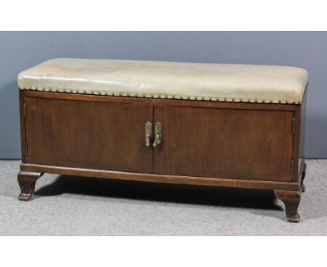 A mahogany box Ottoman/cellaret, the lifting lid upholstered in cream leather and studded, now with led lined interior and du