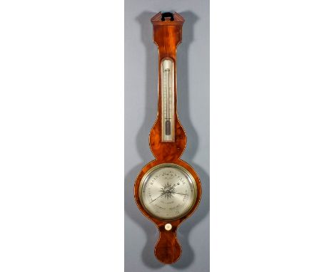 A 19th Century mahogany wheel barometer and thermometer by Cox of London, the 8ins diameter silvered dial with alcohol thermo